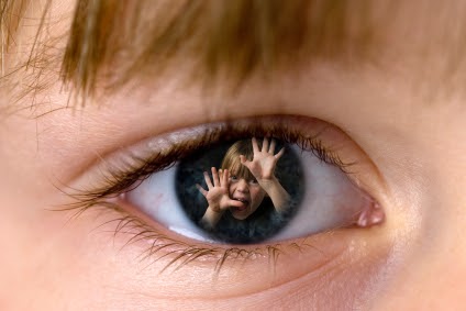 child with a reflection in their eye