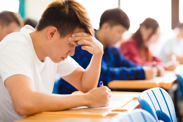 children in a classroom studying